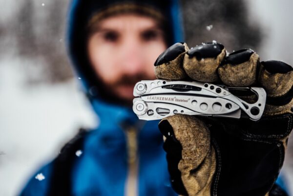Skeletool Lifestyle Outdoor Tool in hand in snow